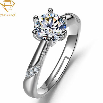 Στρώστε τη θέτοντας ασημένια χάραξη γαμήλιων δαχτυλιδιών διαμαντιών για τις γυναίκες
